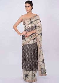 Graphite grey and luminary cream shaded batik print saree only on kalki