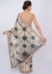 Graphite grey and luminary cream shaded batik print saree only on kalki