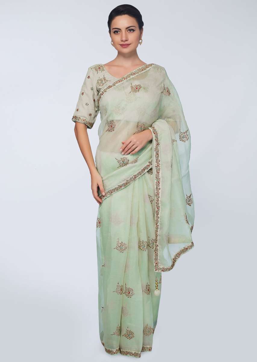 Green organza saree with embroidered butti and border 