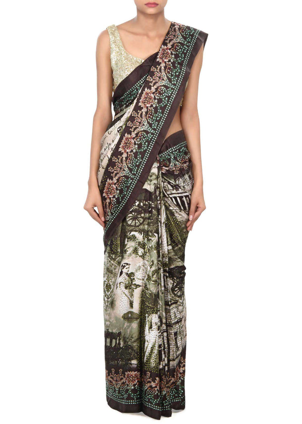 Mossy green saree enhanced in floral print only on Kalki