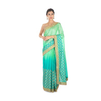 Green shaded  kotta silk saree with weaved hemline