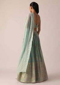 Green Lehenga Set In Brocade Silk With Floral Buttis