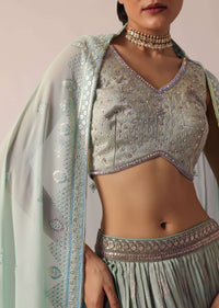 Green Lehenga Set In Brocade Silk With Floral Buttis