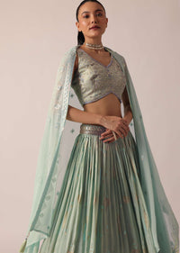 Green Lehenga Set In Brocade Silk With Floral Buttis