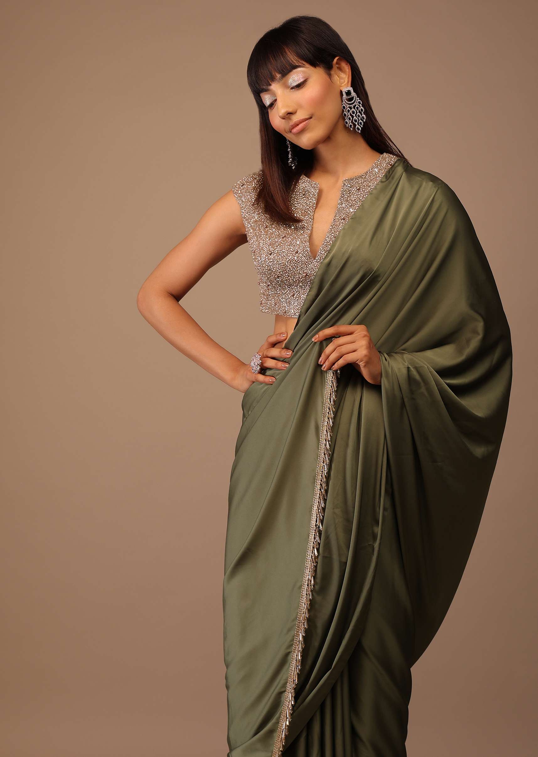 Moss Green Satin Saree With Fringes On Pallu Paired With Deep Neck Hand Embroidered Crop Top
