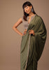 Moss Green Satin Saree With Fringes On Pallu Paired With Deep Neck Hand Embroidered Crop Top