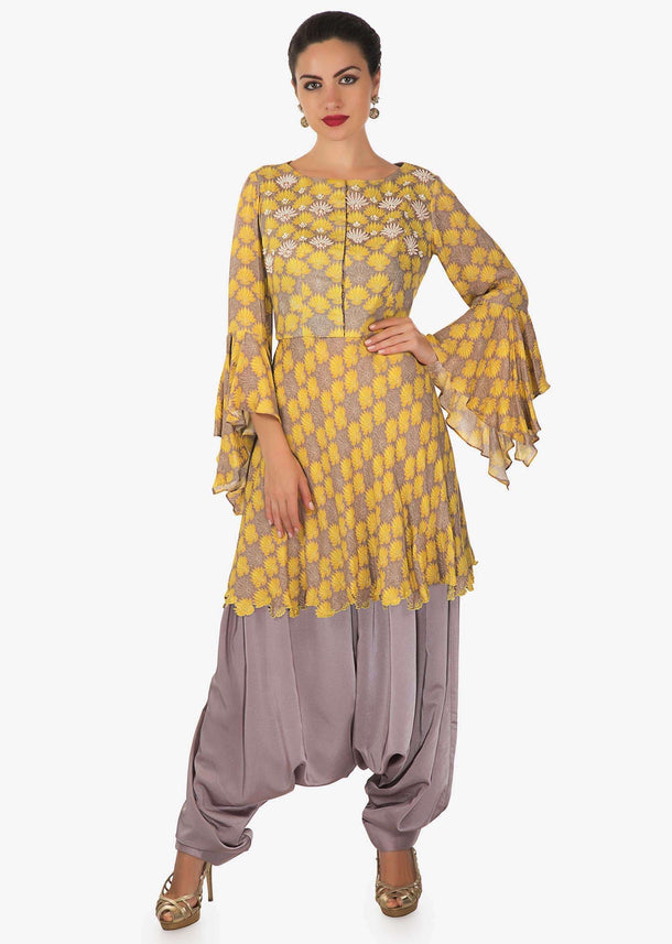 Grey and yellow printed suit adorn in moti with fancy pants only on Kalki