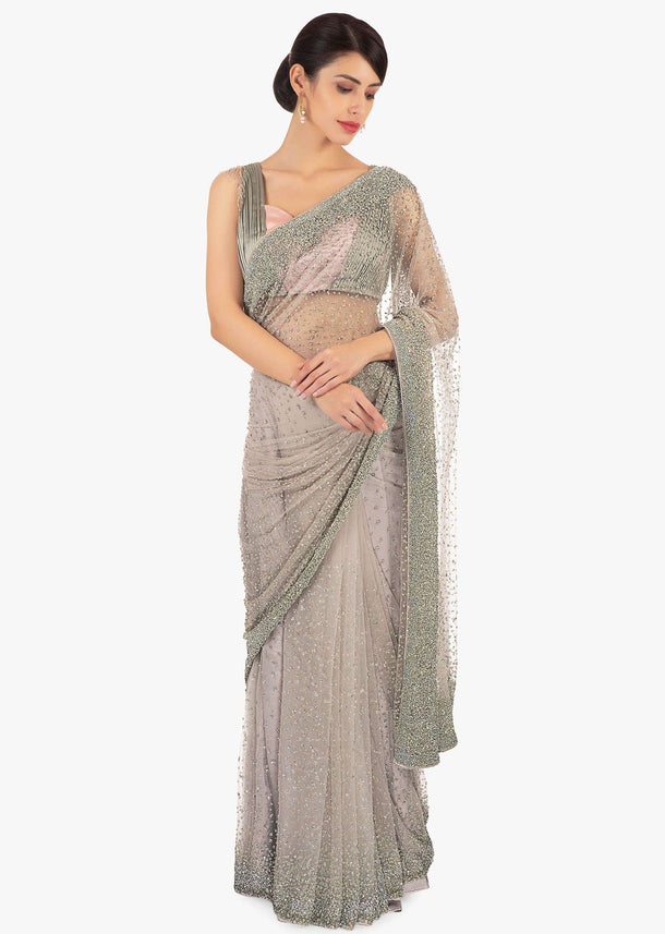 Grey net saree in sequins and moti