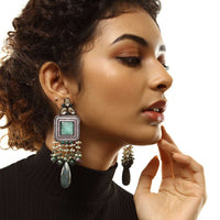 Grey Toned Earrings With Carved Green Stones In Square Shape Along With Green Semi Precious Drops