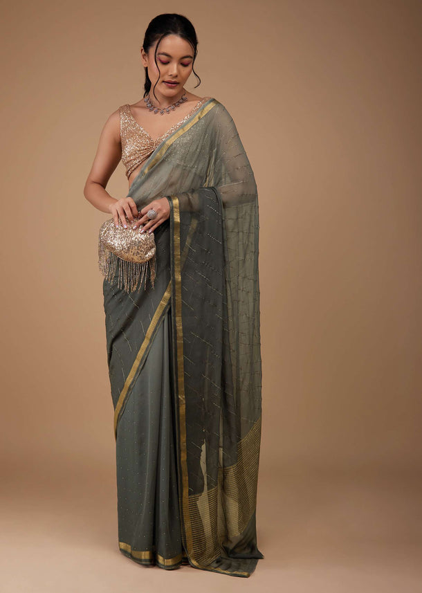 Fog Grey Chiffon Saree With Swarovski Stone Embellishments And Zari Border