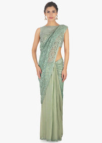 Half and half fern green lace and foil georgette saree in kundan