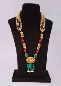 Half and half necklace having upper half in multi string moti layer and lower half in magenta and metallic beads only on Kalki