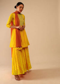 Honey Yellow Sharara Suit In Crepe With Bandhani And Lehariya Print Paired With Moti Embroidered Peplum Kurti