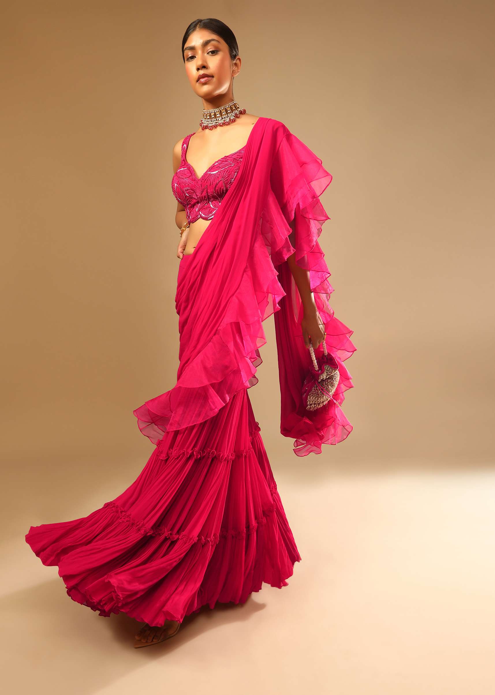 Hot Pink Crop Top Sharara Suit With An Attached Ruffle Draped And An Hand Embroidered Leaf Motifs