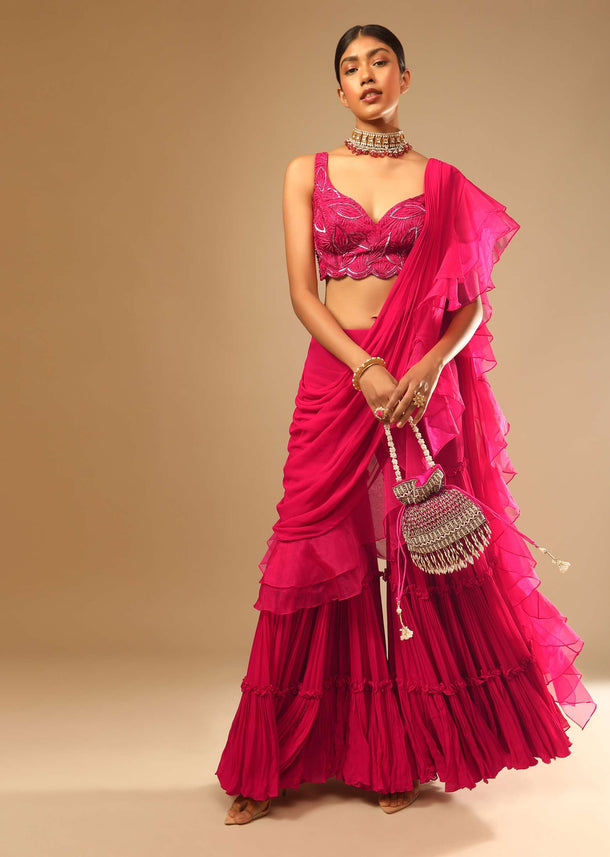 Hot Pink Crop Top Sharara Suit With An Attached Ruffle Draped And An Hand Embroidered Leaf Motifs