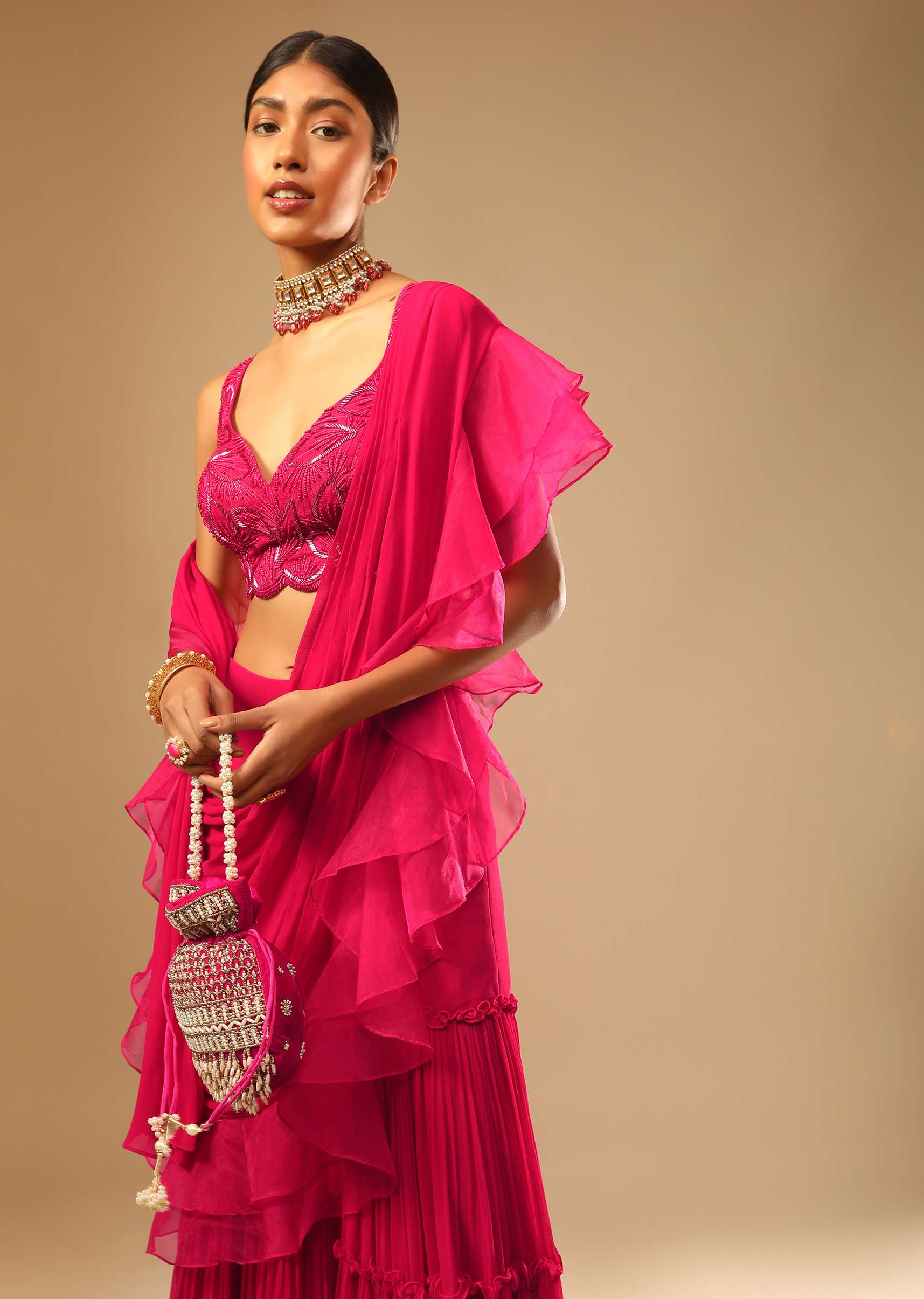 Hot Pink Crop Top Sharara Suit With An Attached Ruffle Draped And An Hand Embroidered Leaf Motifs