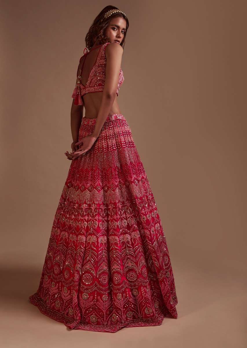 Hot Pink Lehenga Choli In Net With Mirror Work In Floral And Mughal Motifs Along With A Tassel Belt