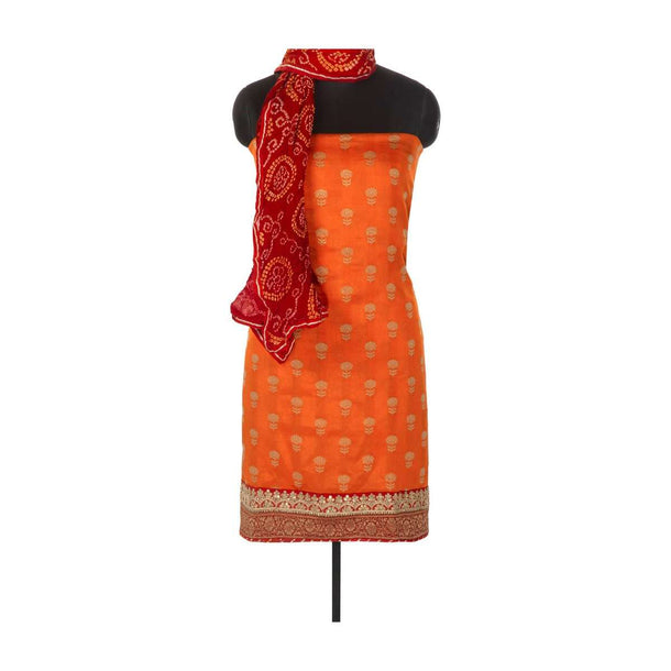 Orange weaved unstitched suit in silk with brocade border only on Kalki