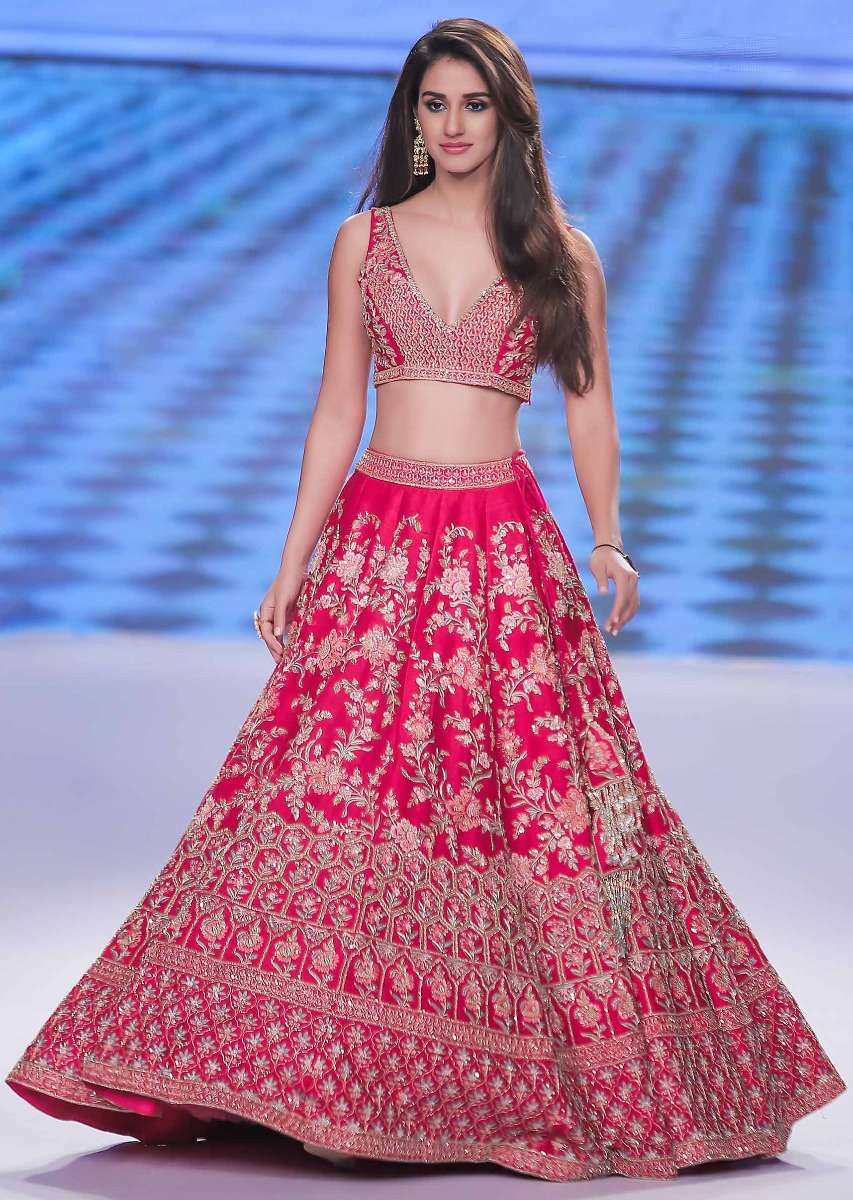 Disha Patani in Kalki mesmerising pink raw silk lehenga set in multi color resham, ari and zardosi embroidery.