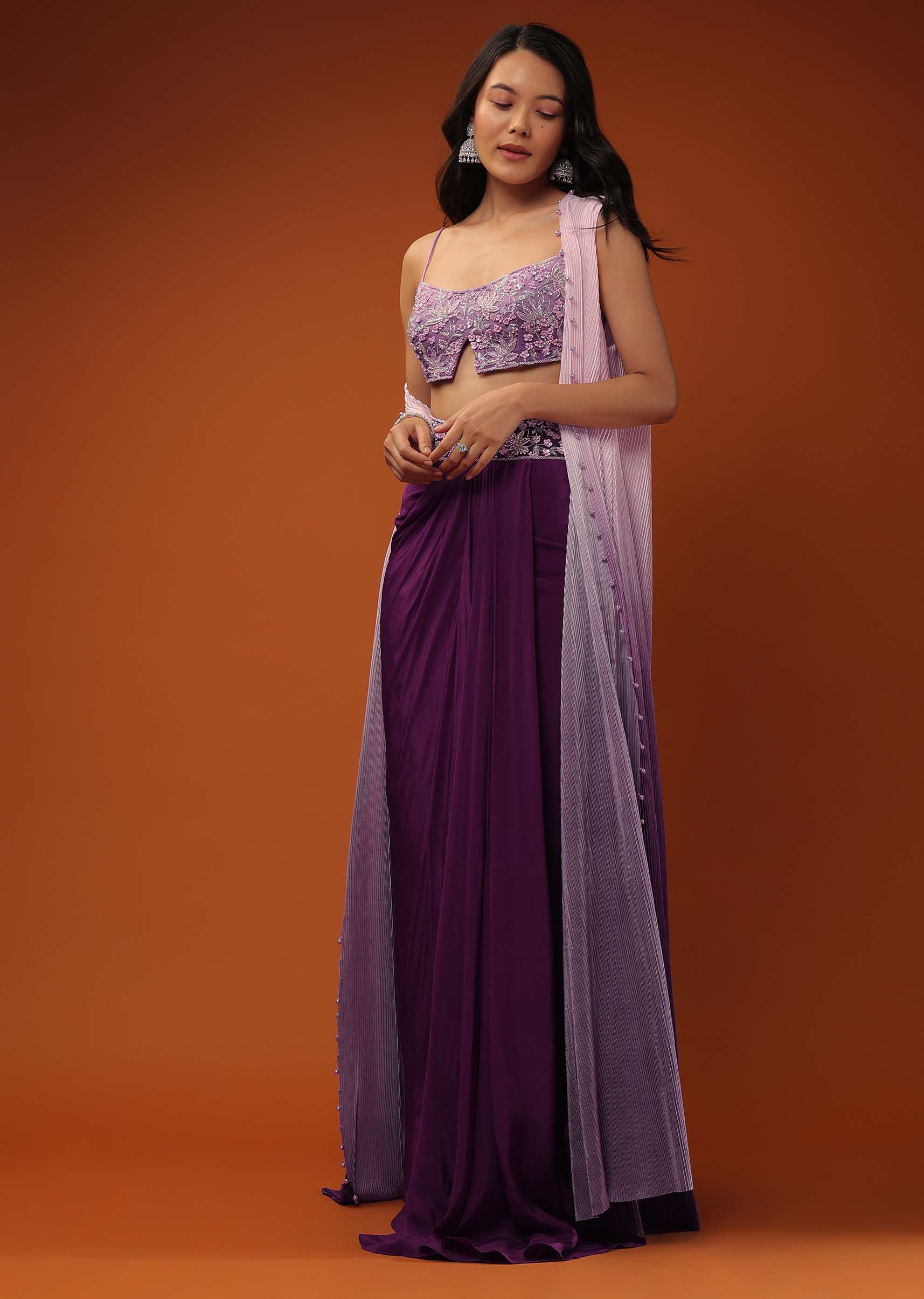 Imperial Purple Dhoti Skirt And A Crop Top In Sequins Embroidery, Paired With A Ombre Extended Jacket In Sleeveless