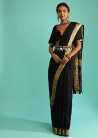 Ink Black Saree In Linen With Golden Brocade Border And Striped Pallu Along With A Matching Unstitched Blouse