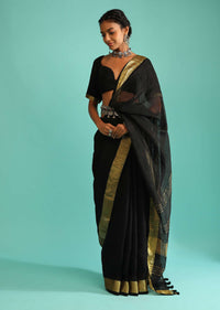 Ink Black Saree In Linen With Golden Brocade Border And Striped Pallu Along With A Matching Unstitched Blouse