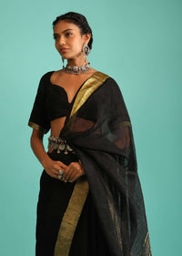 Ink Black Saree In Linen With Golden Brocade Border And Striped Pallu Along With A Matching Unstitched Blouse