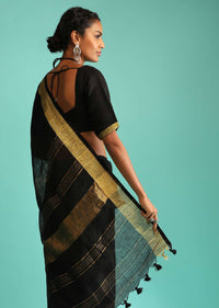 Ink Black Saree In Linen With Golden Brocade Border And Striped Pallu Along With A Matching Unstitched Blouse