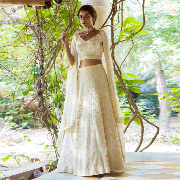 Ivory Lehenga Choli In Georgette With Lucknowi Embroidery In Geometric And Floral Motifs Online - Kalki Fashion