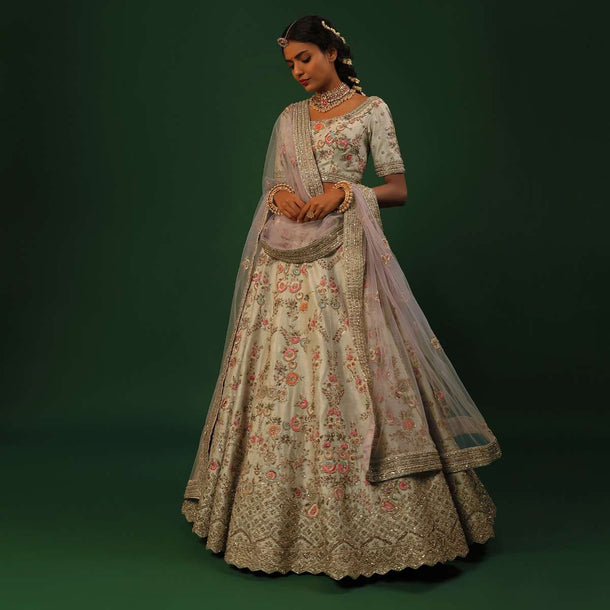 Ivory Lehenga Choli In Raw Silk With Colorful Resham And Golden Zardosi Embroidered Floral Jaal And Cut Work Border