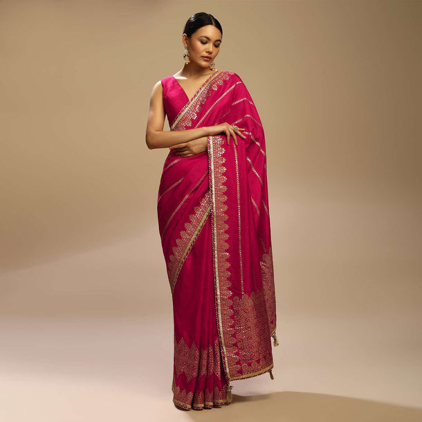 Rani Pink Saree In Silk With Woven Stripes Floral Motifs On The Border