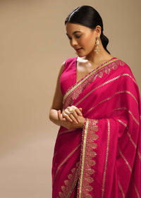 Rani Pink Saree In Silk With Woven Stripes Floral Motifs On The Border