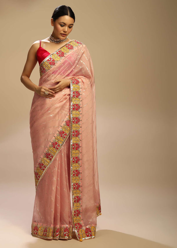 Pastel Peach Saree With Lurex Stripes, Fuchsia And Yellow Patchwork And Gotta Patti On The Border