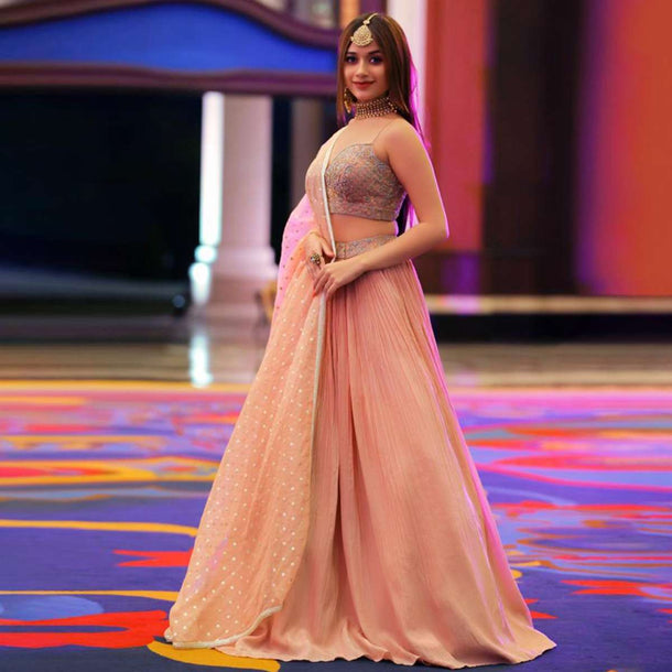 Jannat Zubair In Kalki Powder Peach Lehenga Choli With Hand Embroidery Using Turquoise And Pink Sequins Work