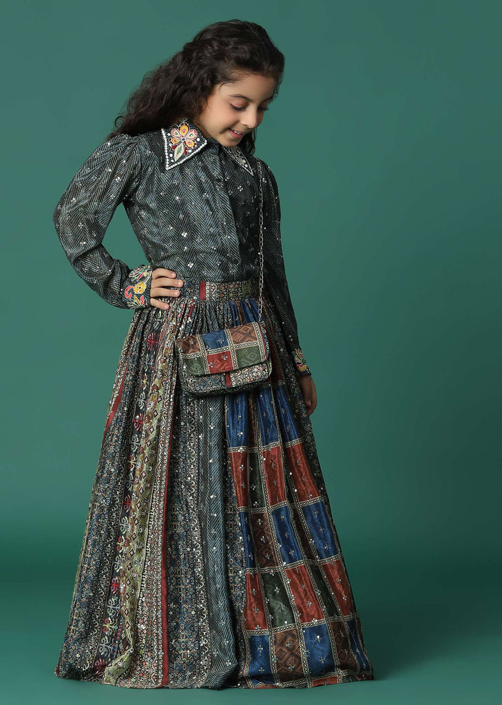 Kalki Multi Colored Top And Skirt Set In Satin Blend With A Matching Sling Bag