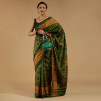 Forest Green Saree In Silk With Ikat Weave Patola Work