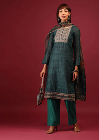 Deep Green Palazzo Suit In Tussar Silk With A Stunning Potli Bag
