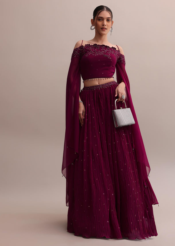 Lavish Wine Georgette Lehenga And Off-Shoulder Crop Top With Attached Cape