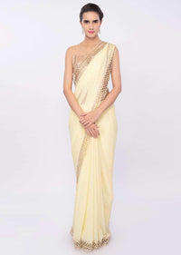 Lemon yellow georgette saree with cut out border only on Kalki