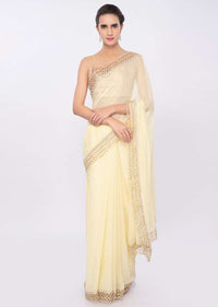 Lemon yellow georgette saree with cut out border only on Kalki