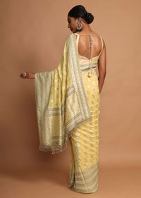 Lemon Yellow Saree In Georgette With Weaved Floral Buttis Online - Kalki Fashion
