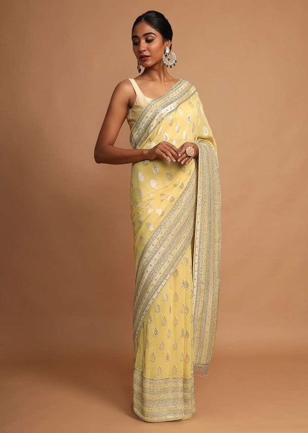 Lemon Yellow Saree In Georgette With Weaved Floral Buttis Online - Kalki Fashion