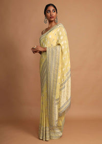 Lemon Yellow Saree In Georgette With Weaved Floral Buttis Online - Kalki Fashion