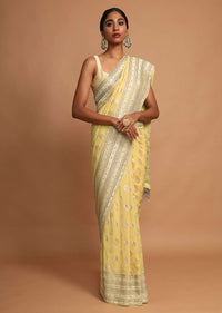 Lemon Yellow Saree In Georgette With Weaved Floral Buttis Online - Kalki Fashion