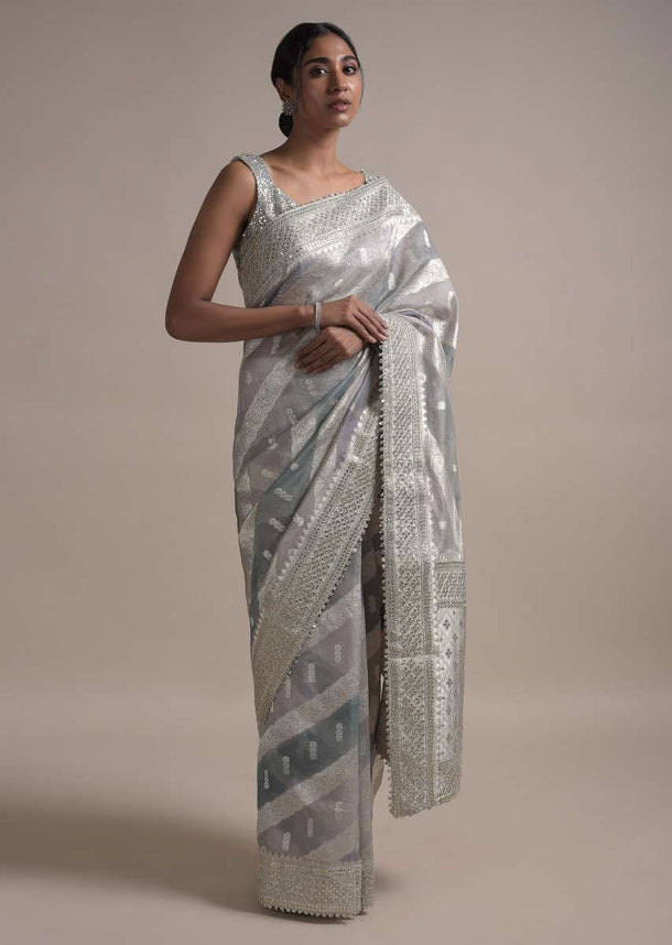 Light And Dark Grey Shaded Saree In Organza With Weaved Floral Pattern In Diagonal Stripes Online - Kalki Fashion