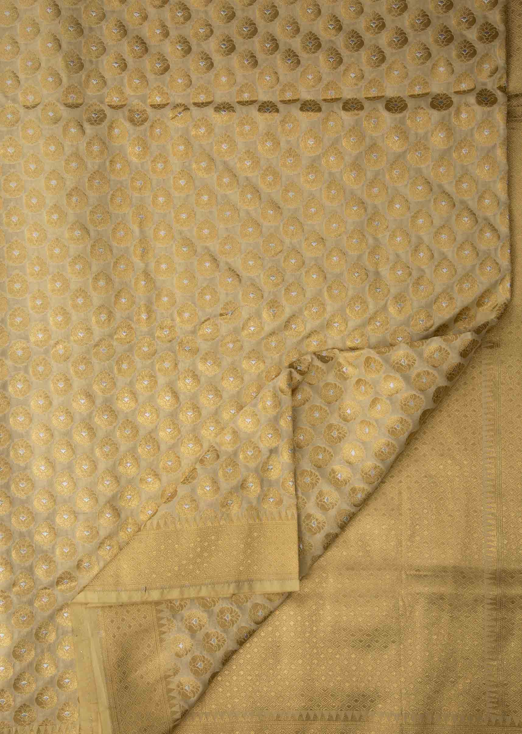 Light cream chanderi silk saree with weaved butti and geometric motif pallav border