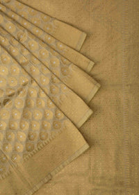 Light cream chanderi silk saree with weaved butti and geometric motif pallav border