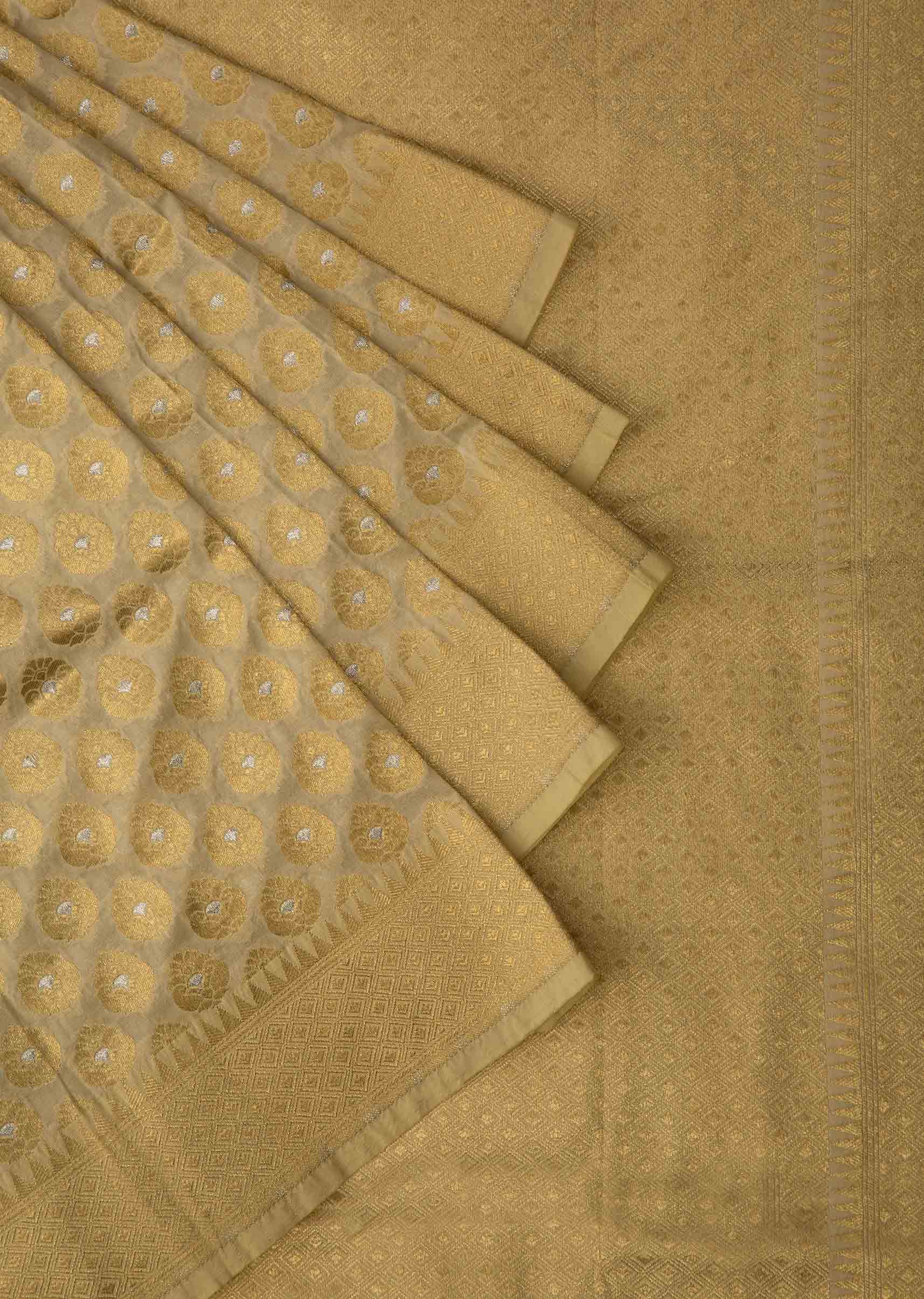 Light cream chanderi silk saree with weaved butti and geometric motif pallav border