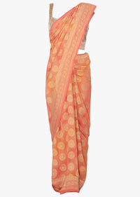 Light peach georgette saree in stripes and weaved butti only on Kalki