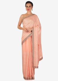 Light pink saree in georgette with thread and kundan work only on Kalki